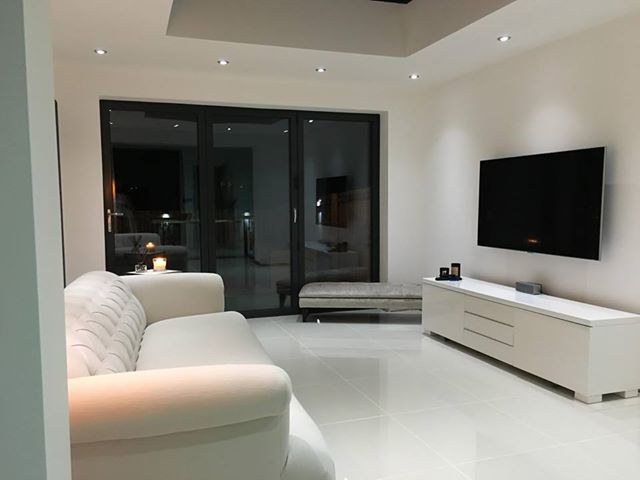 white living room Photo gallery of completed conservatory installations by Cannon Conservatories